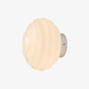 White ribbed glass wall sconce with chrome finish