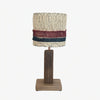 Red and blue stripe loofah table lamp on a white background
