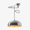 Adjustable chrome pendant light shown with a warm bulb installed