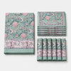 Folded sage green floral cotton linen tablecloth set