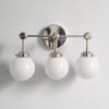 Three-Light Wall Sconce - Modern Brass & Glass Lighting for Home
