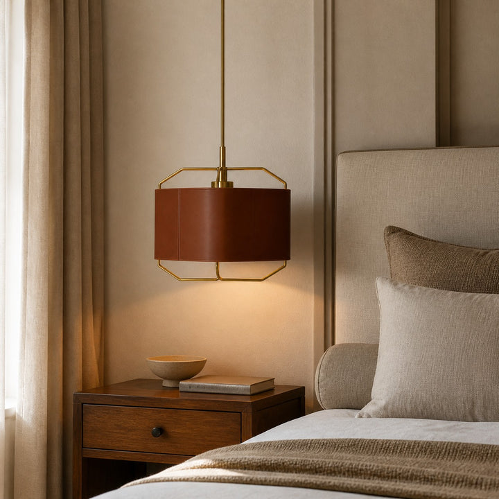 Chestnut brown leather pendant lamp beside a bed