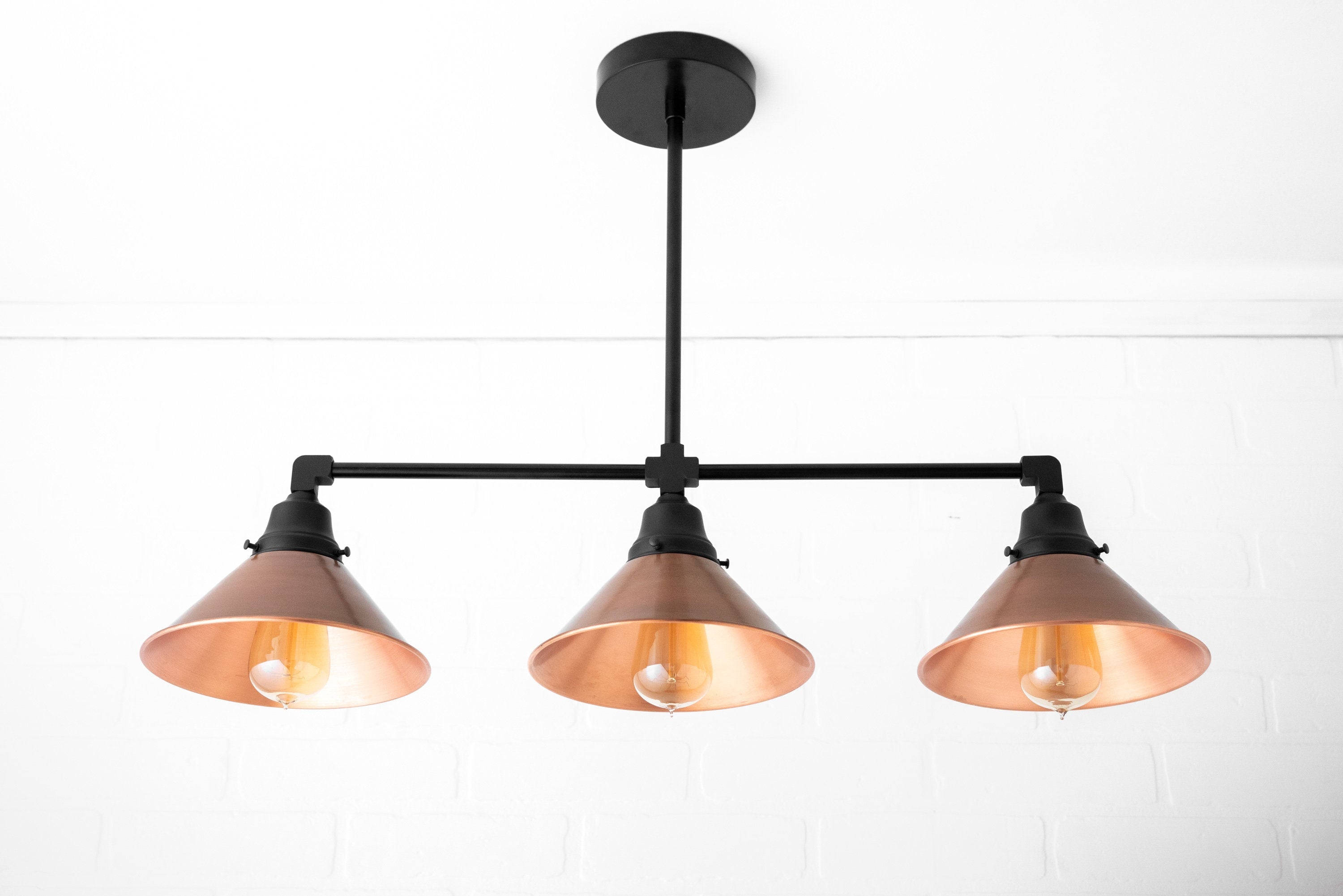 Conique Metal Aged Copper Three-Light Pendant – Sleek Industrial Fixture for Dining Rooms
