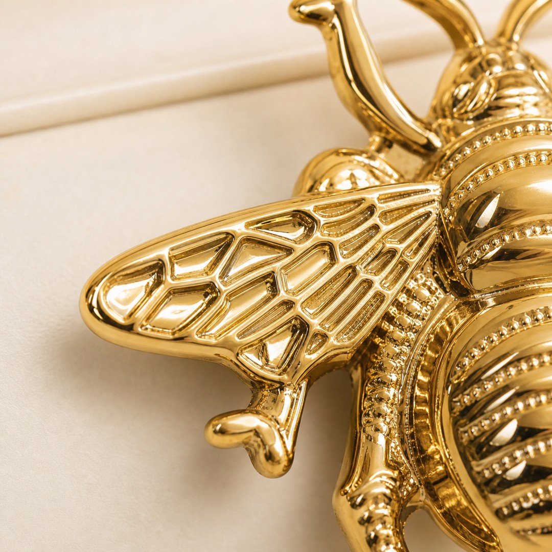 Gold Totem bee handle wing texture detail