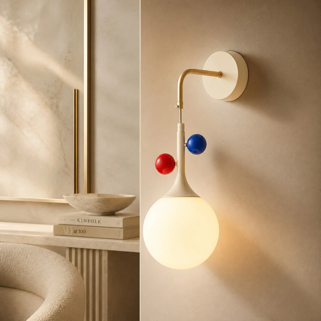 Cream orbit-disc globe wall sconce in a warm lounge