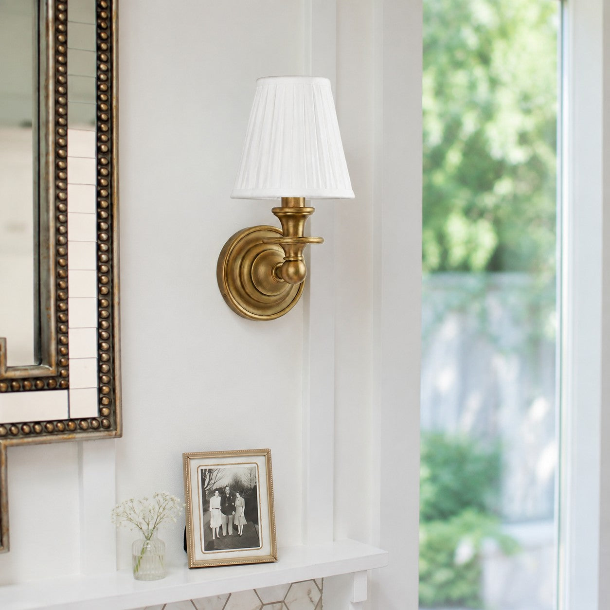 Kalvora White Plain Brass wall sconce in a bright hallway