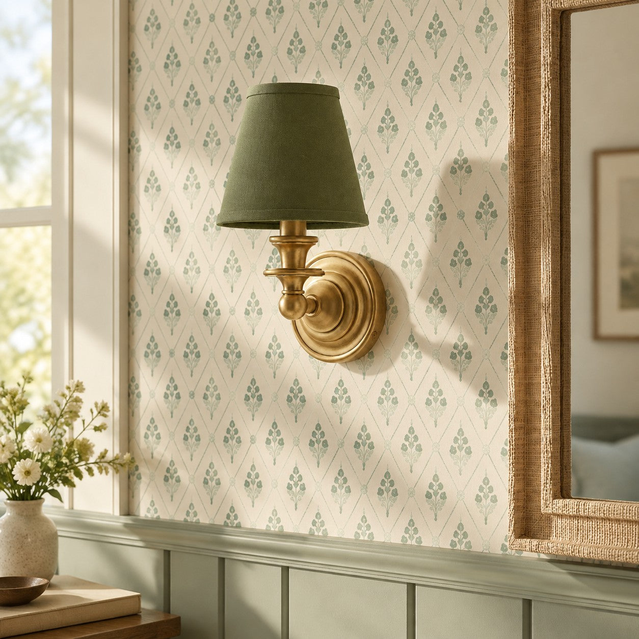 Kalvora Green Plain Brass wall sconce on patterned wallpaper