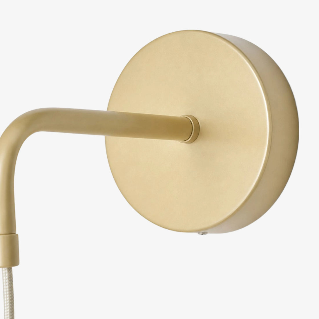 Brushed gold wall backplate and arm detail
