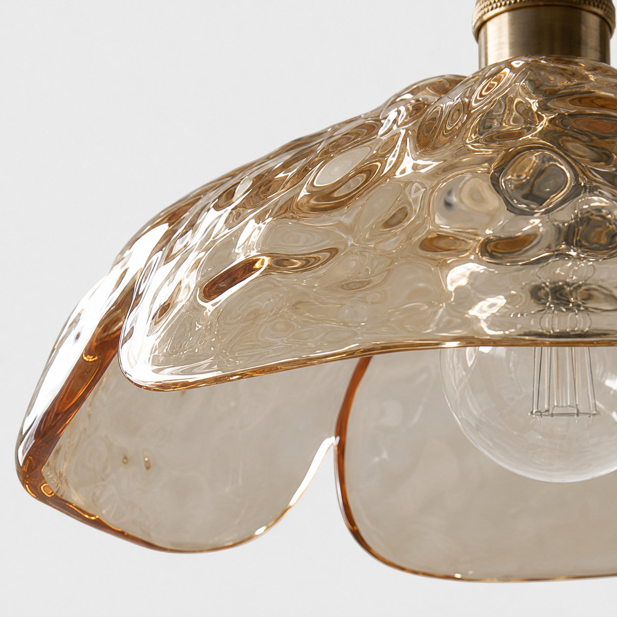 Close-up of clear pressed-glass petal edge