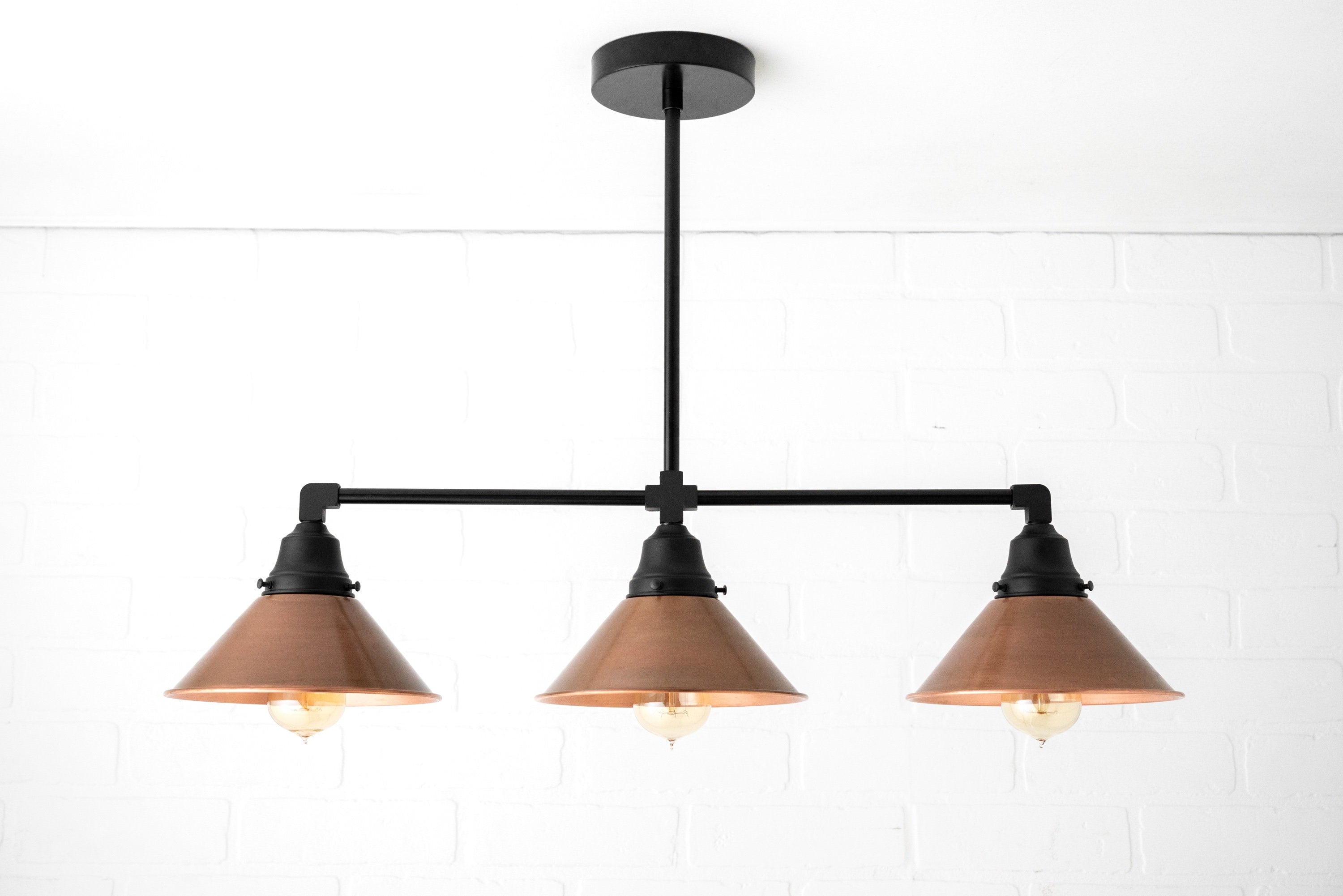 Conique Metal Aged Copper Three-Light Pendant – Sleek Industrial Fixture for Dining Rooms