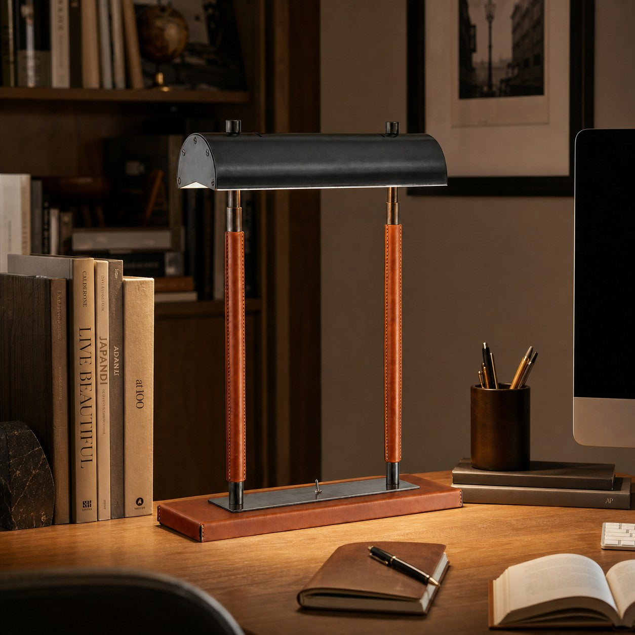 Orange leather table lamp in a dark study