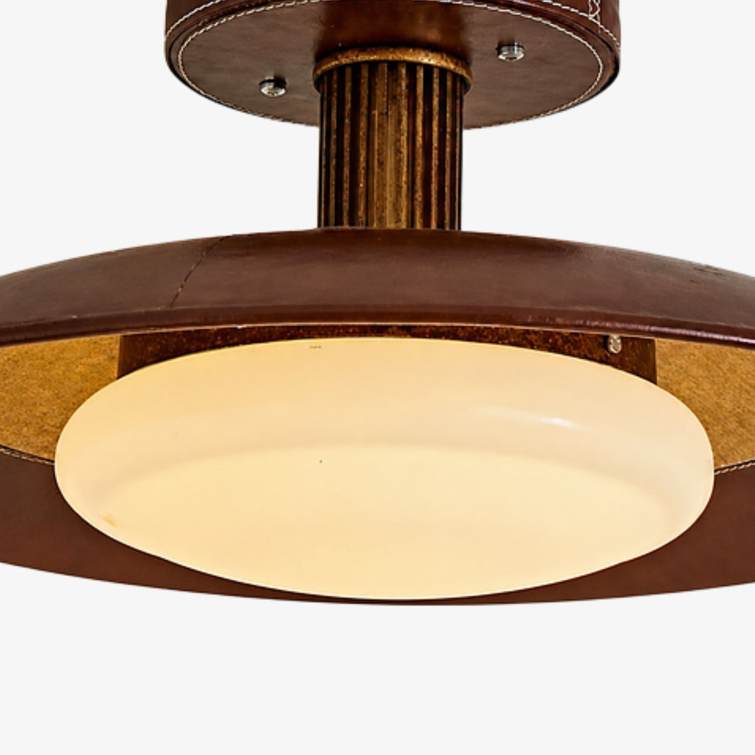 Opal glass shade and leather-wrapped disc detail