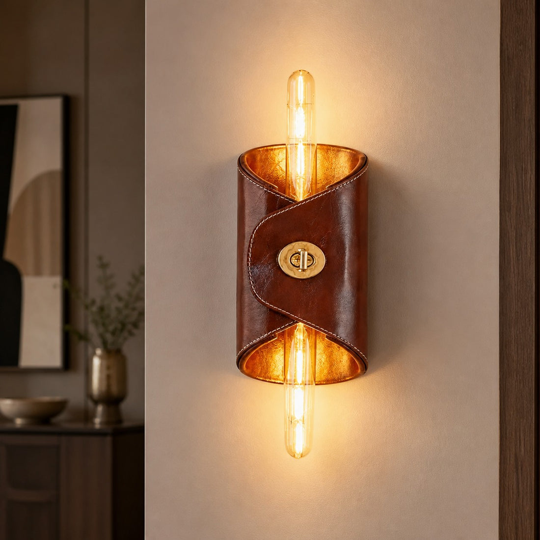 Brown leather wall lamp glowing in a warm hallway