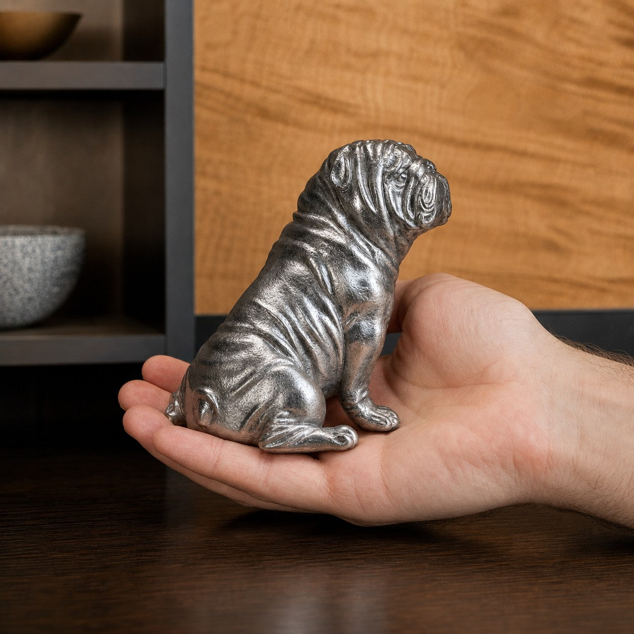 Compact Floxo white copper bulldog sculpture held in hand
