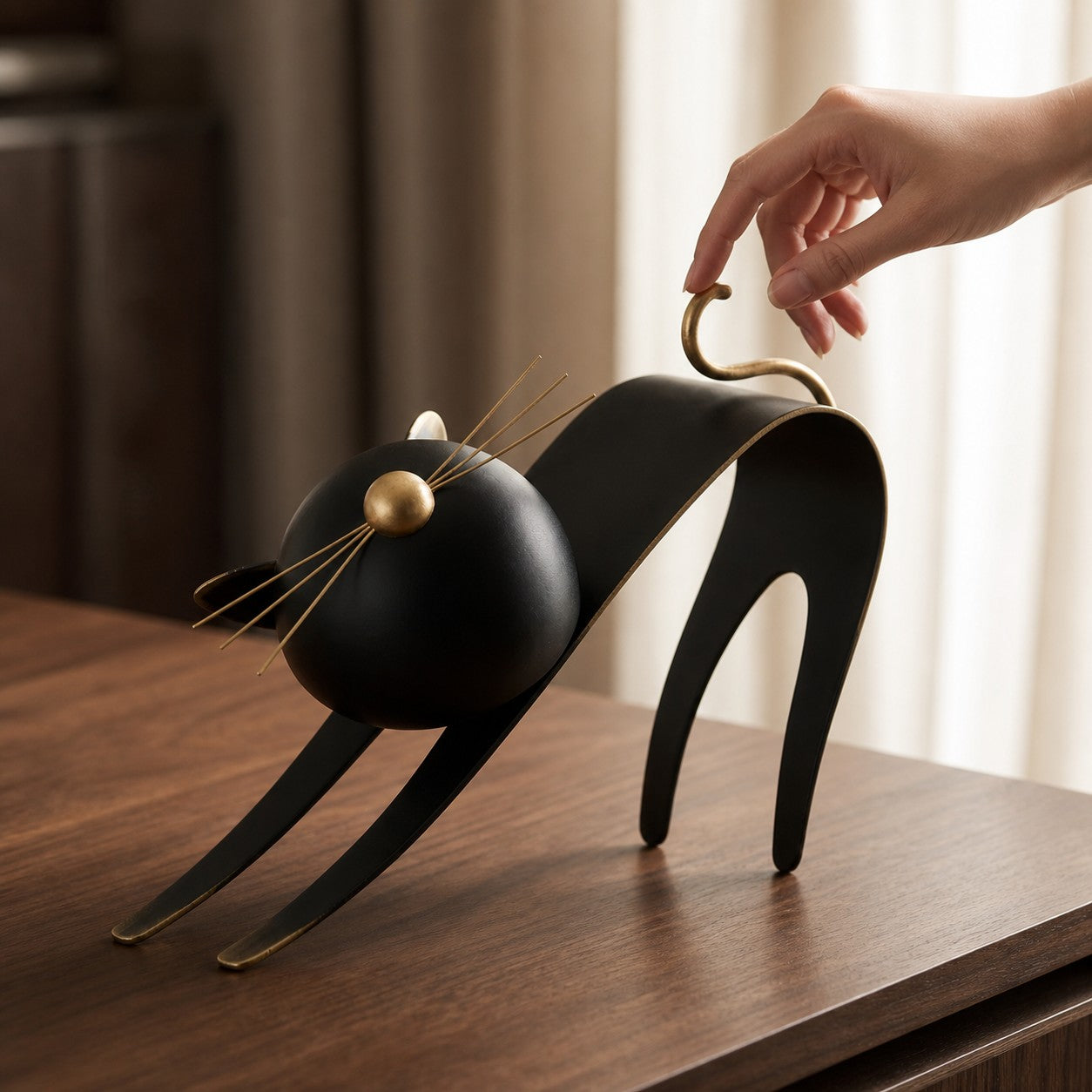 Felora sculptural metal cat figurine styled on a wood table