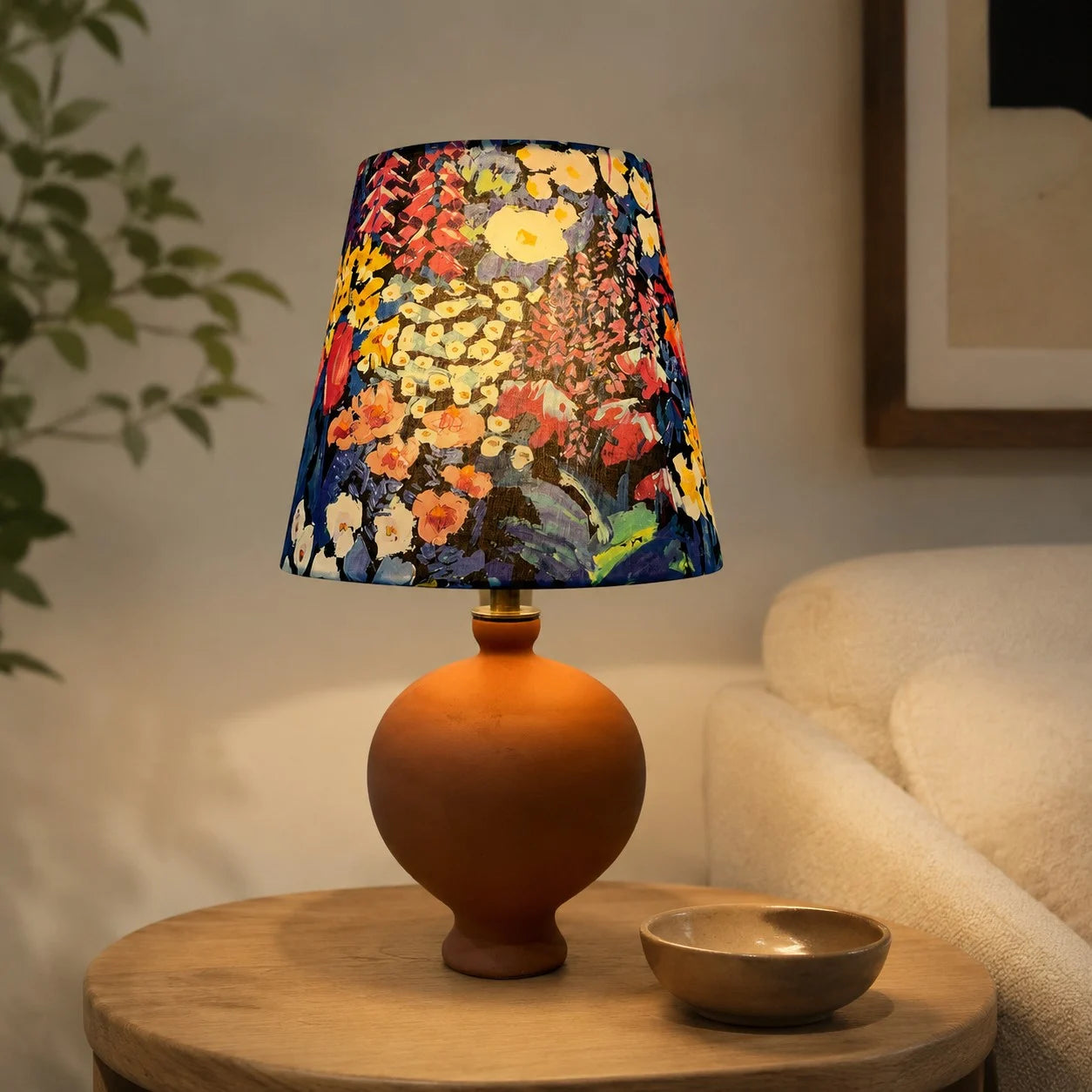 Painter floral ceramic table lamp on a side table