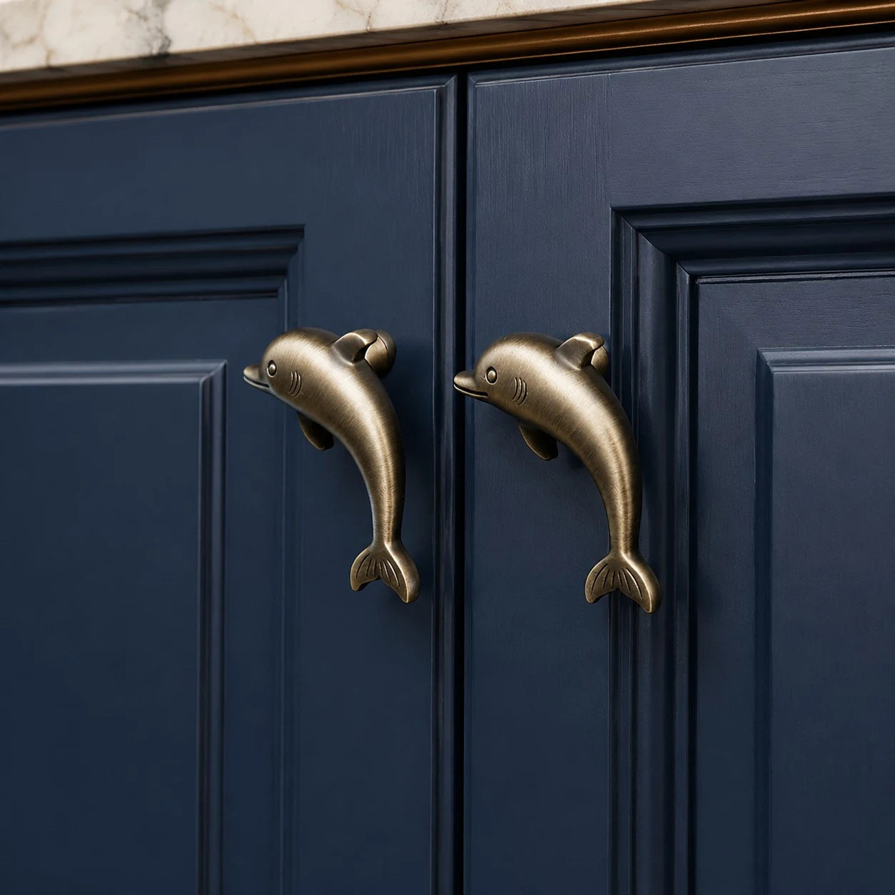 Dolphin Antique Brass cabinet knob installed scene