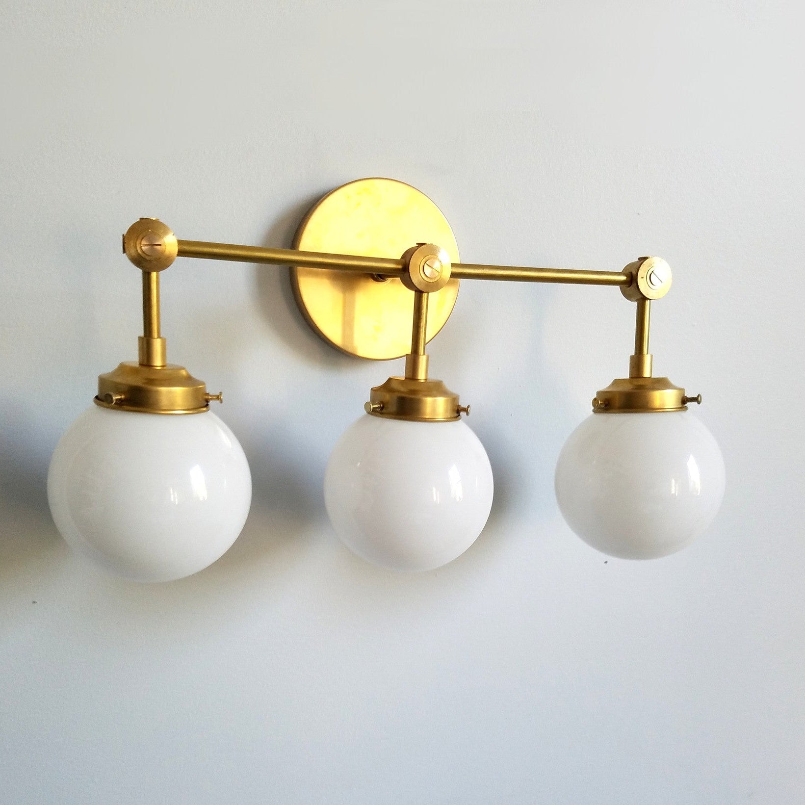 Three-Light Wall Sconce - Modern Brass & Glass Lighting for Home