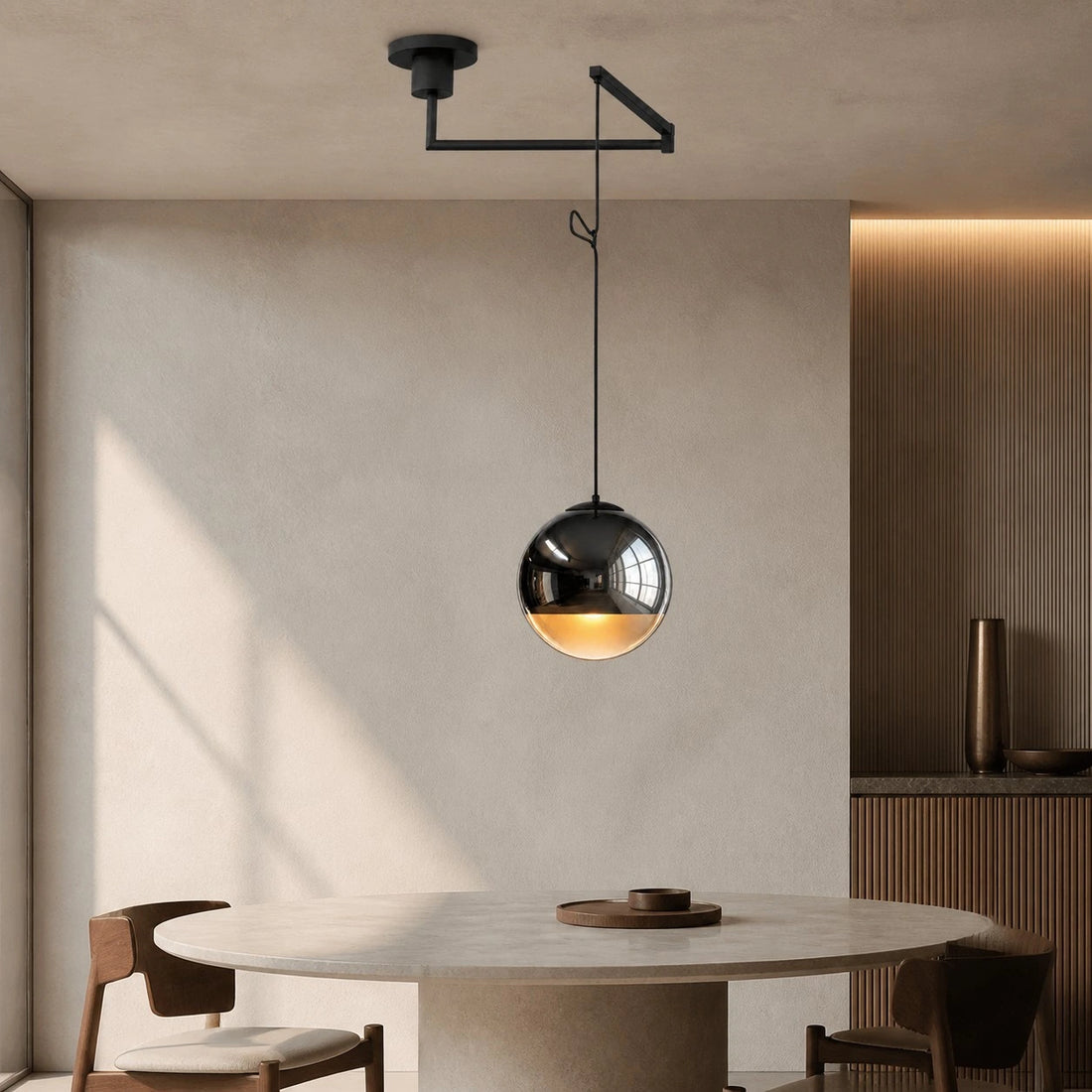 Style B swing-arm Luma pendant above a dining table