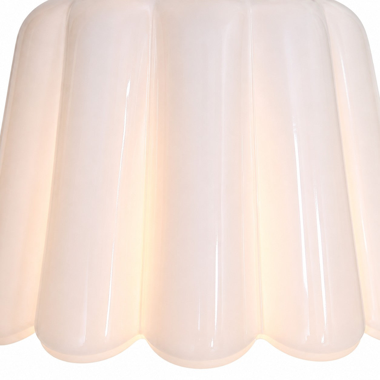 Close view of white scalloped ceramic shade