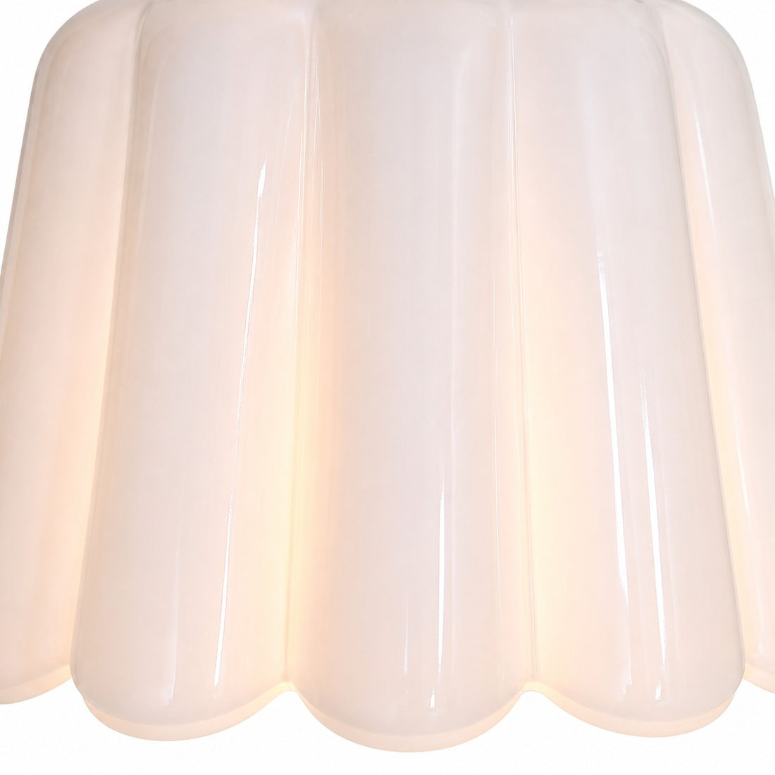 Close view of white scalloped ceramic shade