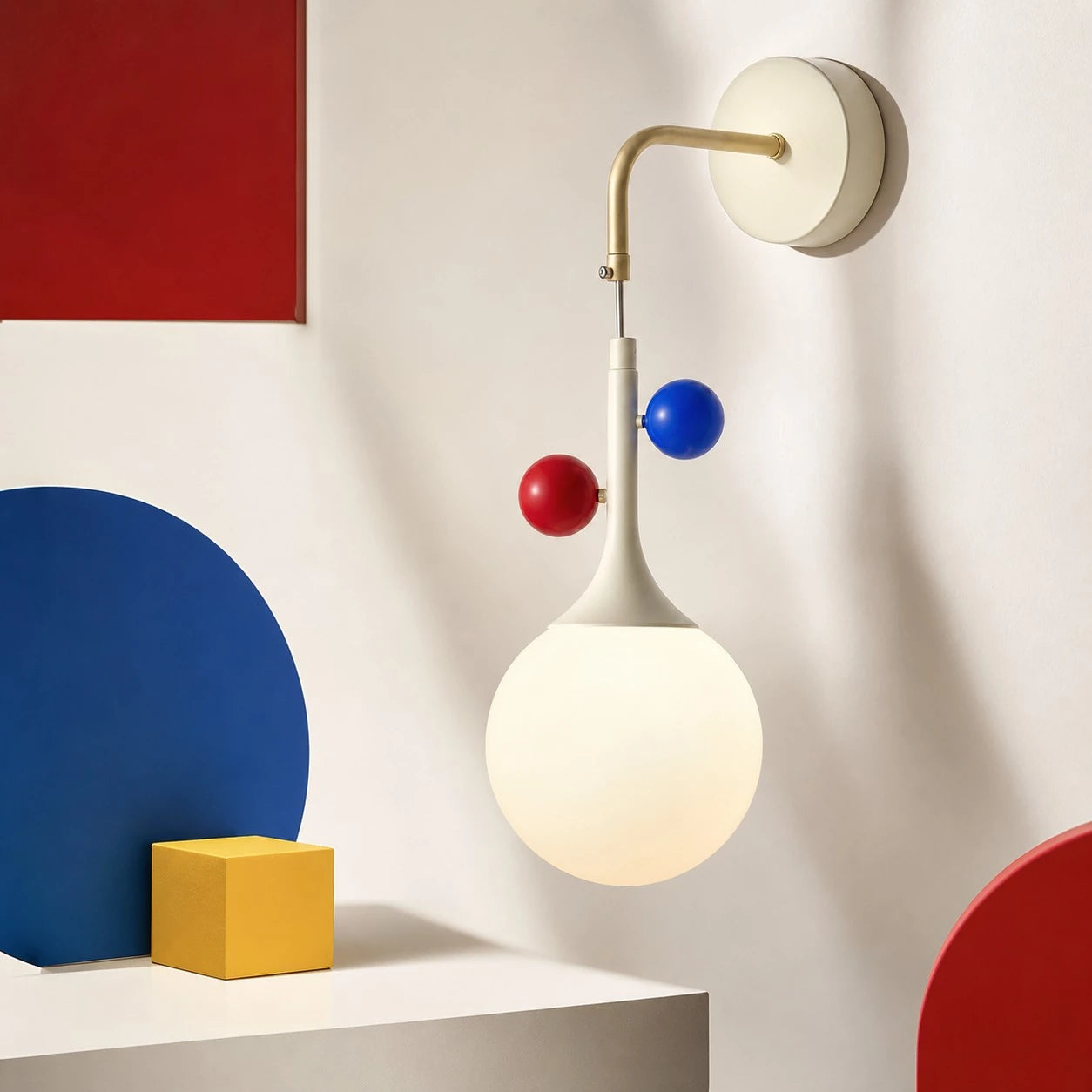 Cream orbit-disc globe wall sconce in a graphic interior