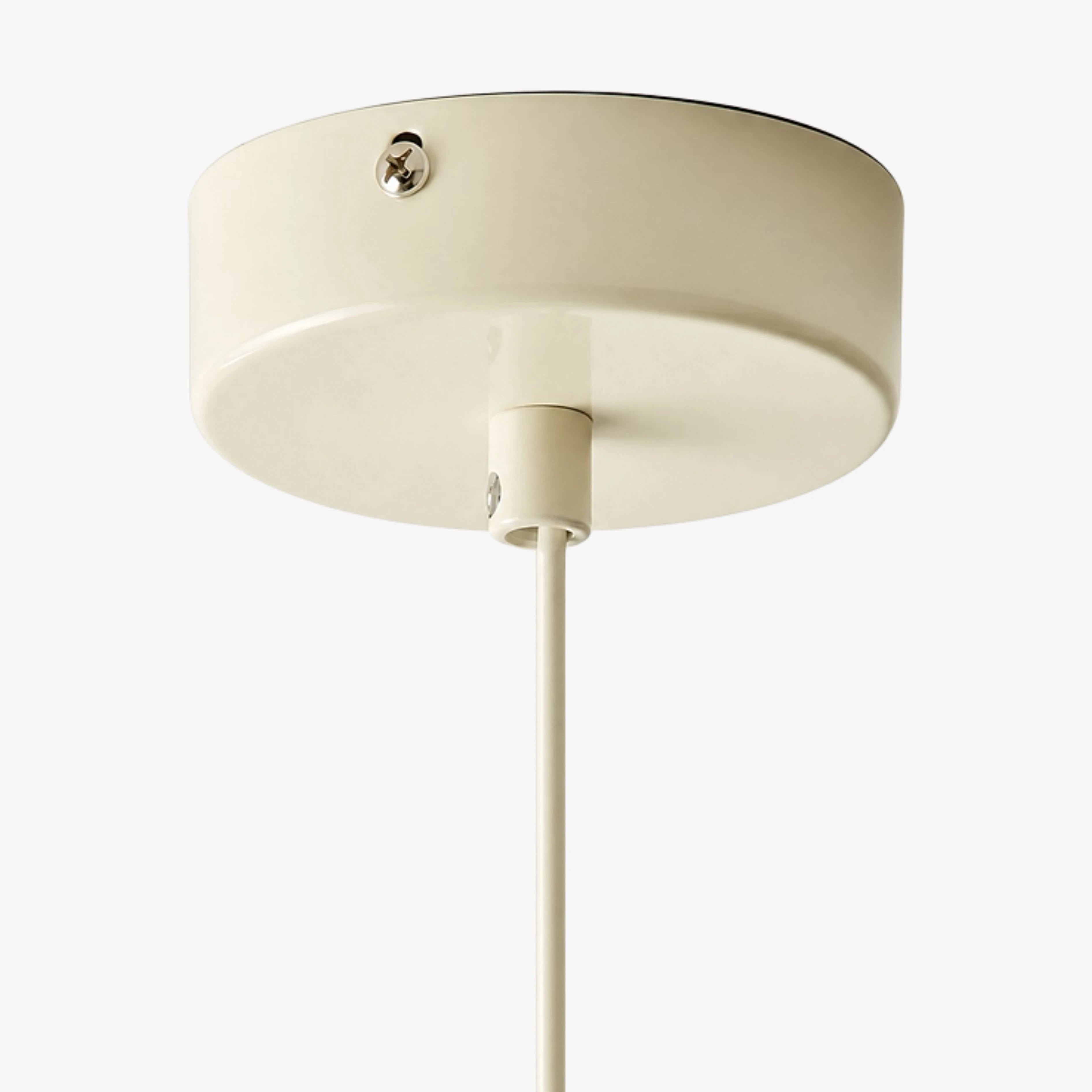 Cream ceiling canopy and suspension cable detail