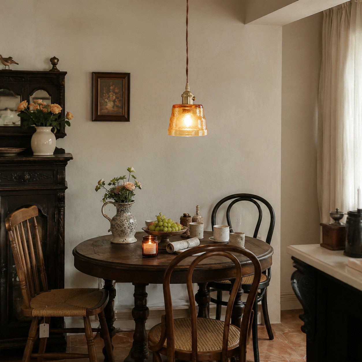 Amber glass pendant light in a vintage dining room