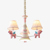 Pink kids room chandelier with three fabric shades
