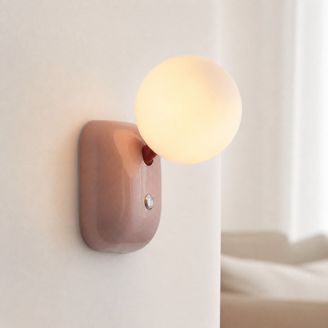 Luma Pink wall sconce in a soft bedroom