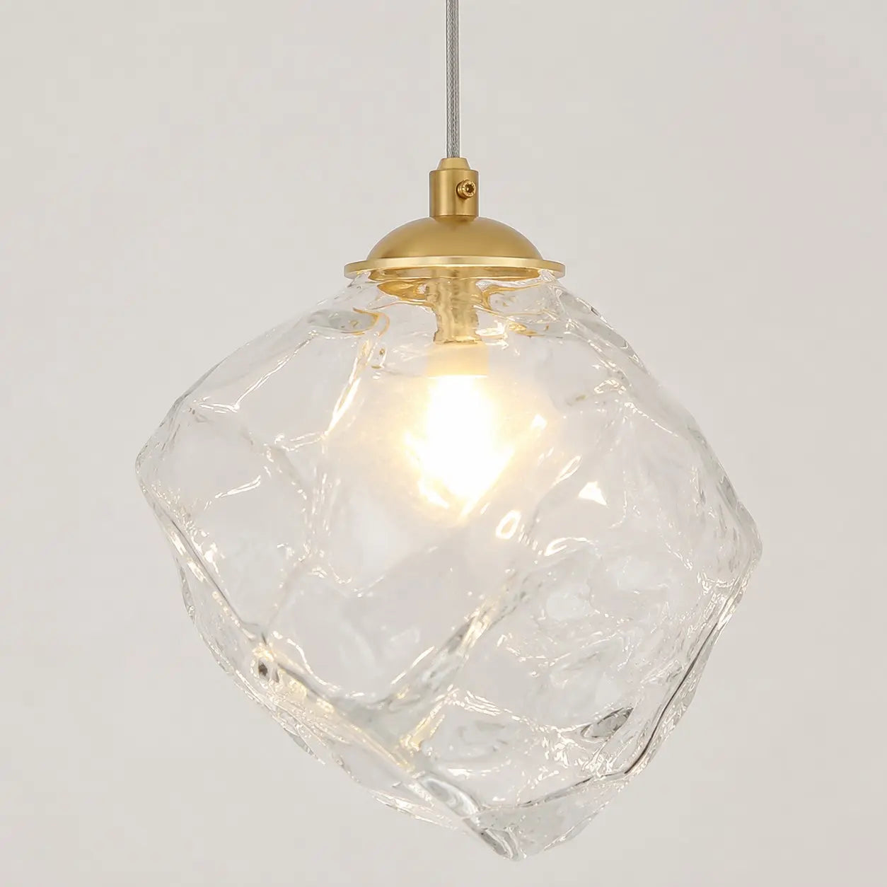 Close-up of irregular transparent glass shade