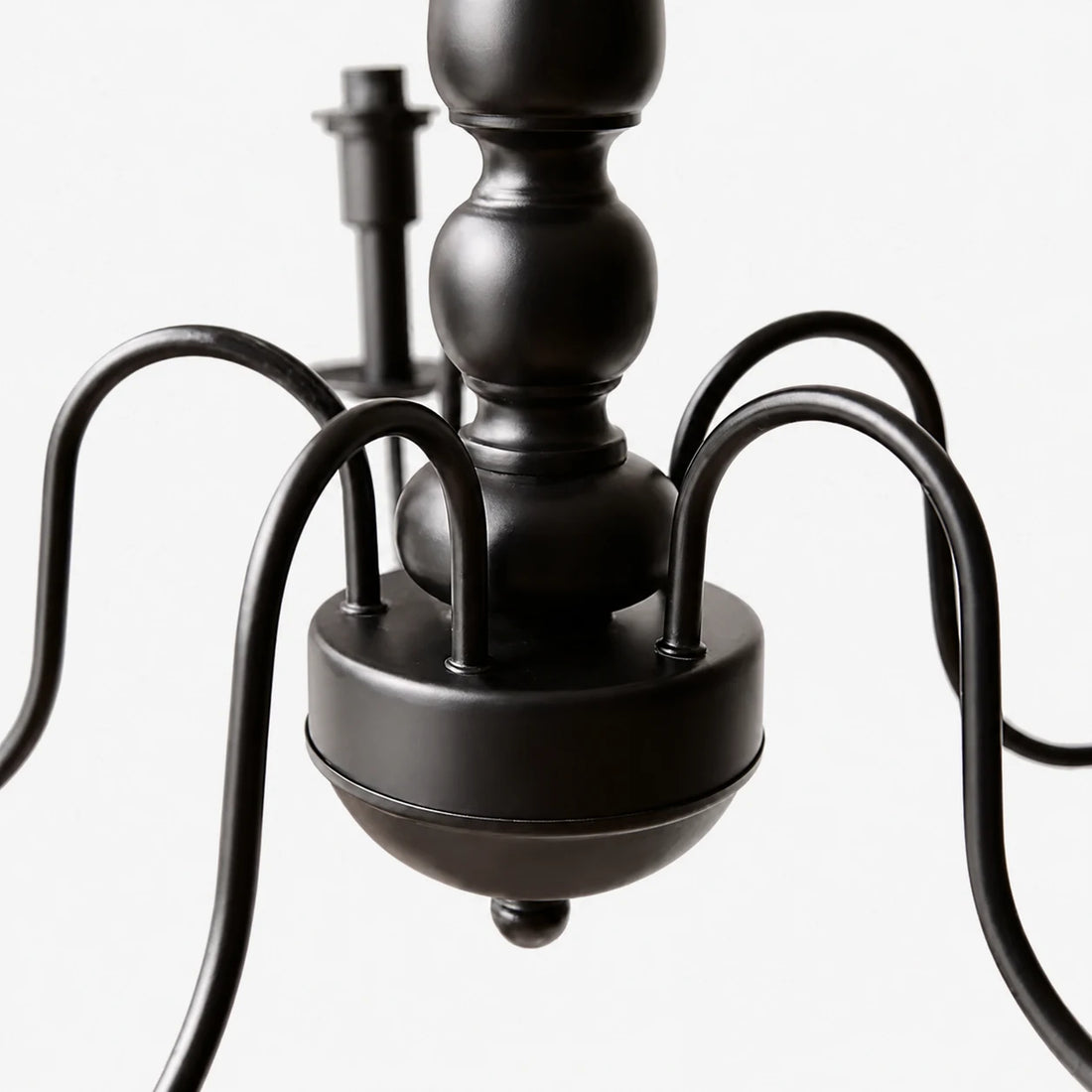 Close view of the black curved chandelier arms and central body