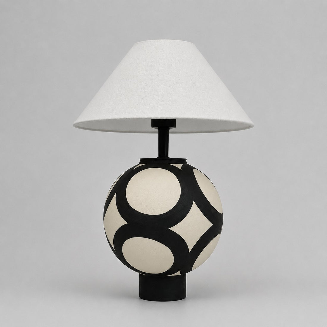 black and ivory ceramic globe table lamp with white fabric shade