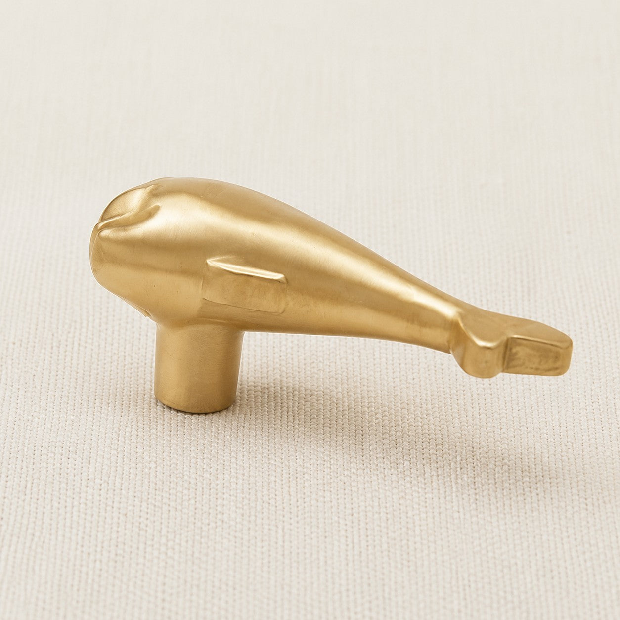 Side view of the dolphin cabinet handle showing the mounting post