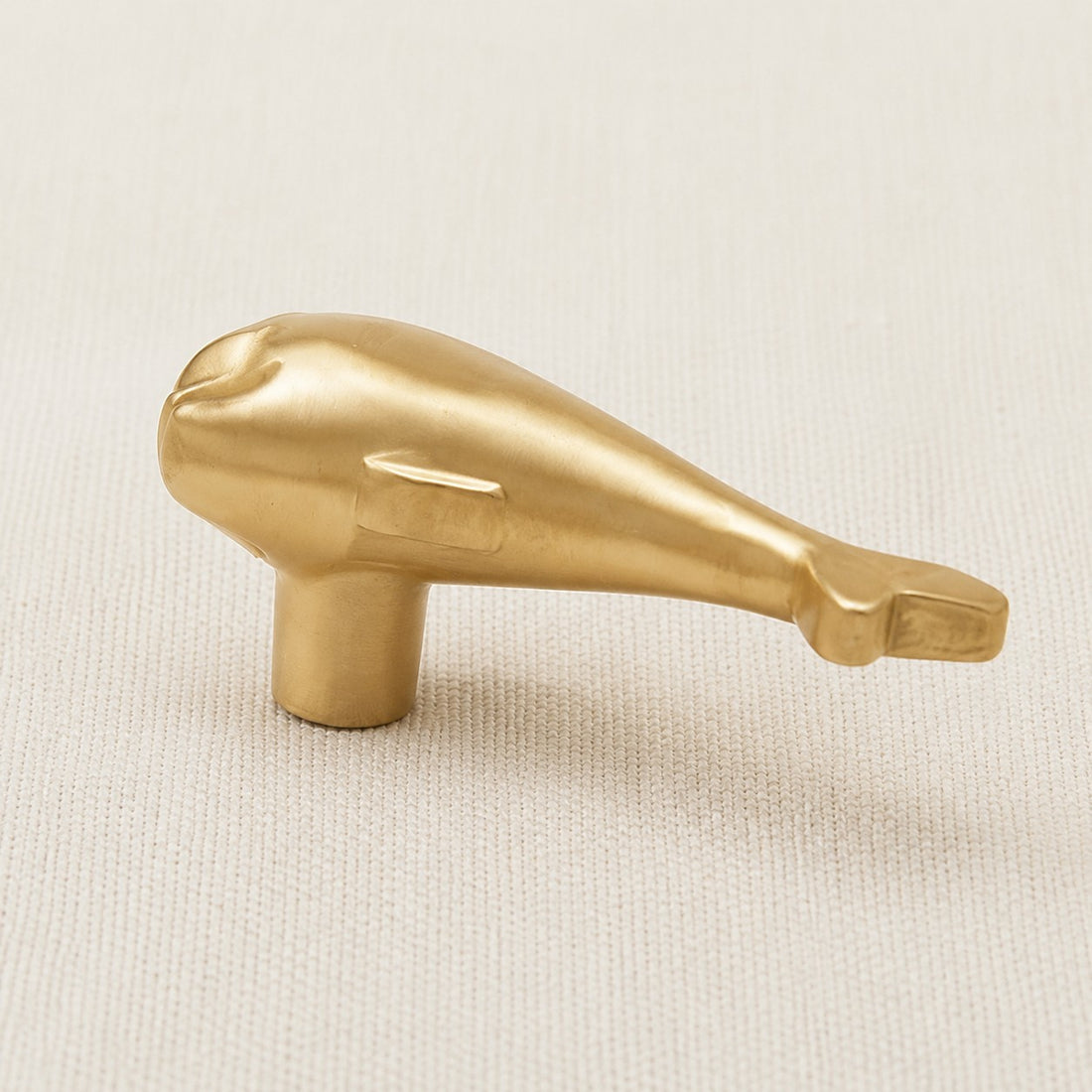 Side view of the dolphin cabinet handle showing the mounting post