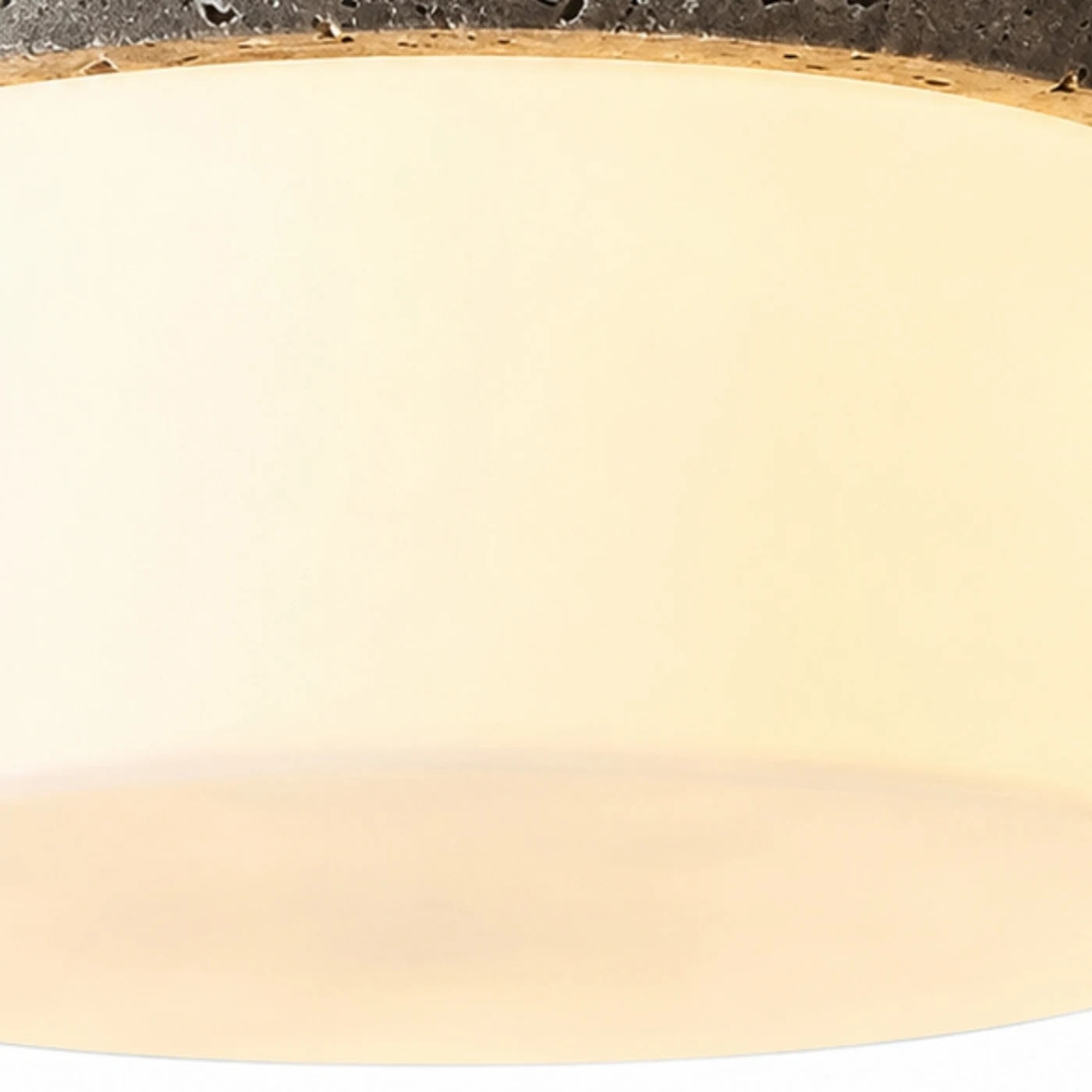 Close detail of warm glass shade and soft diffuser glow