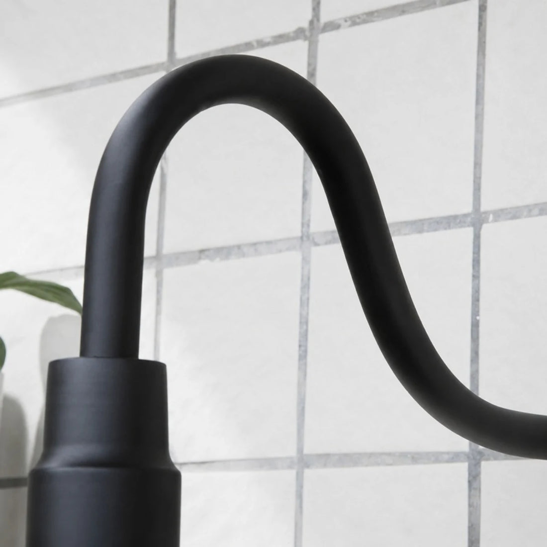 Matte black gooseneck arm and socket detail