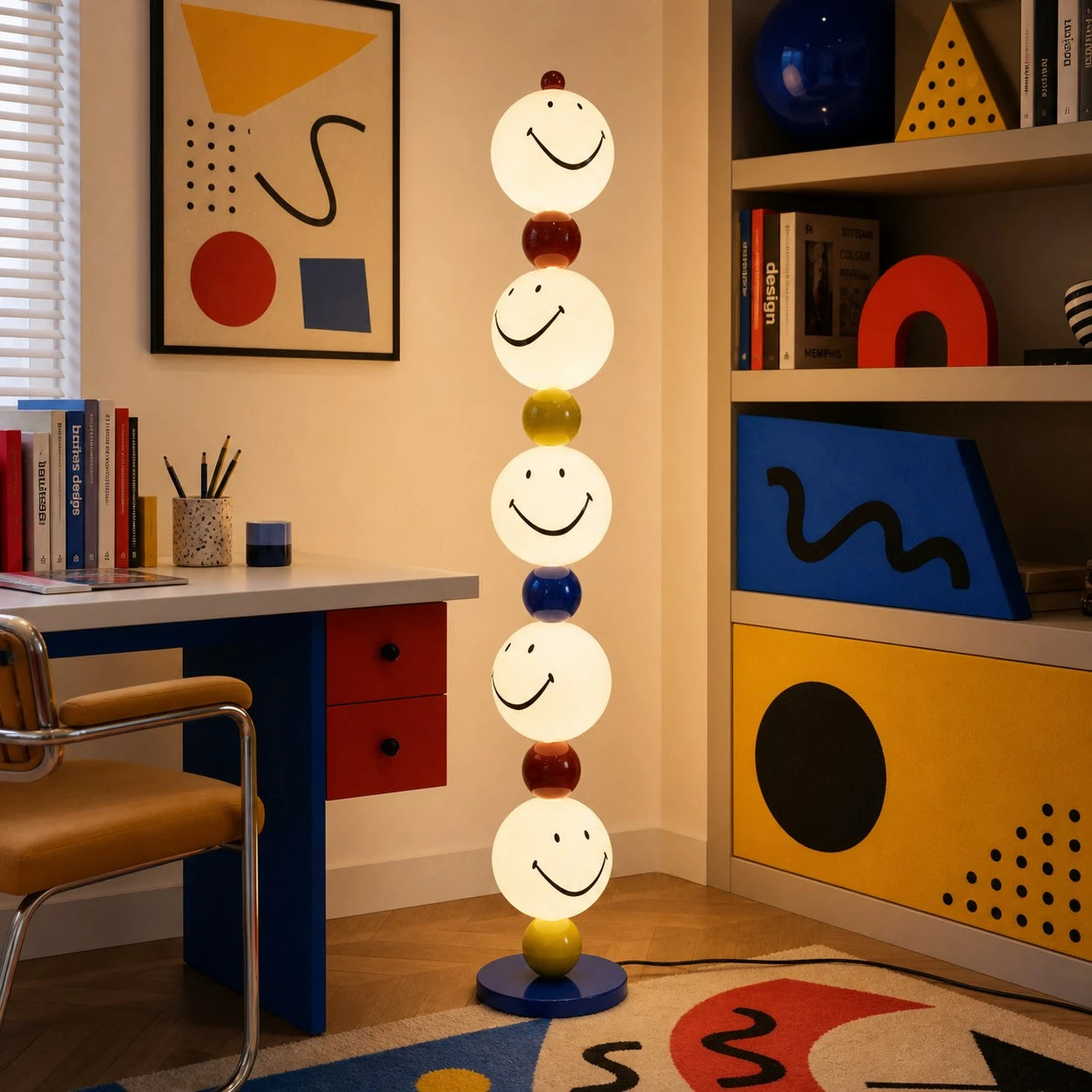 Smiley stack floor lamp beside a graphic study area