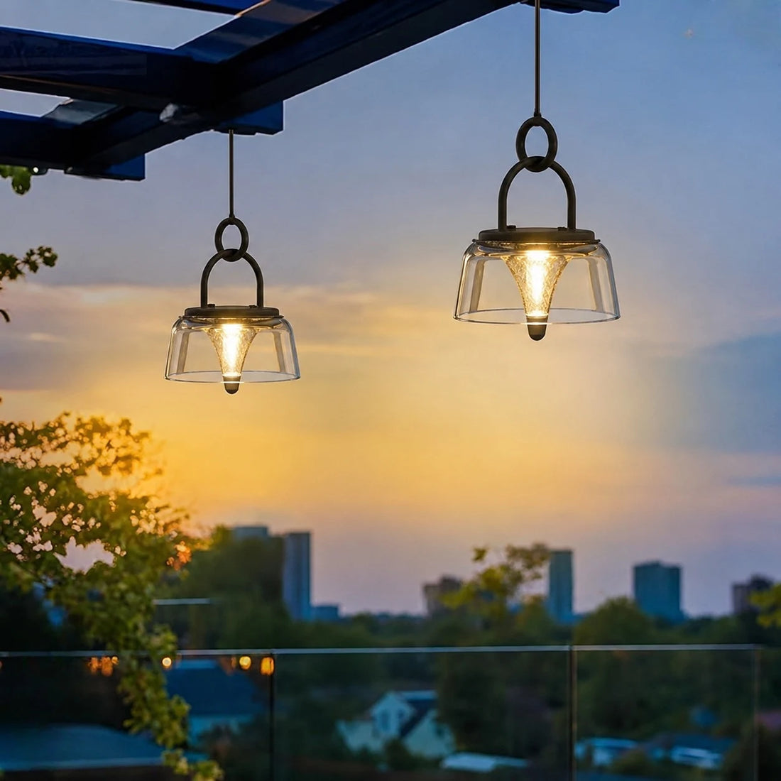 Pair of solar lanterns hanging on a balcony at dusk