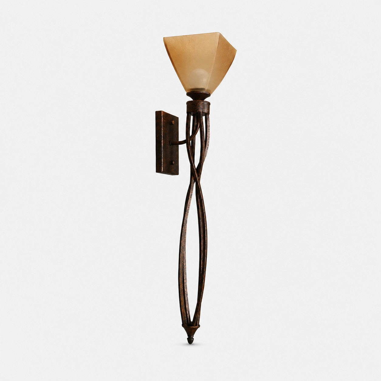 Sculptural aged bronze amber glass wall sconce on a light background