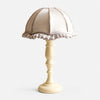 Silver fabric shade wood table lamp on white background