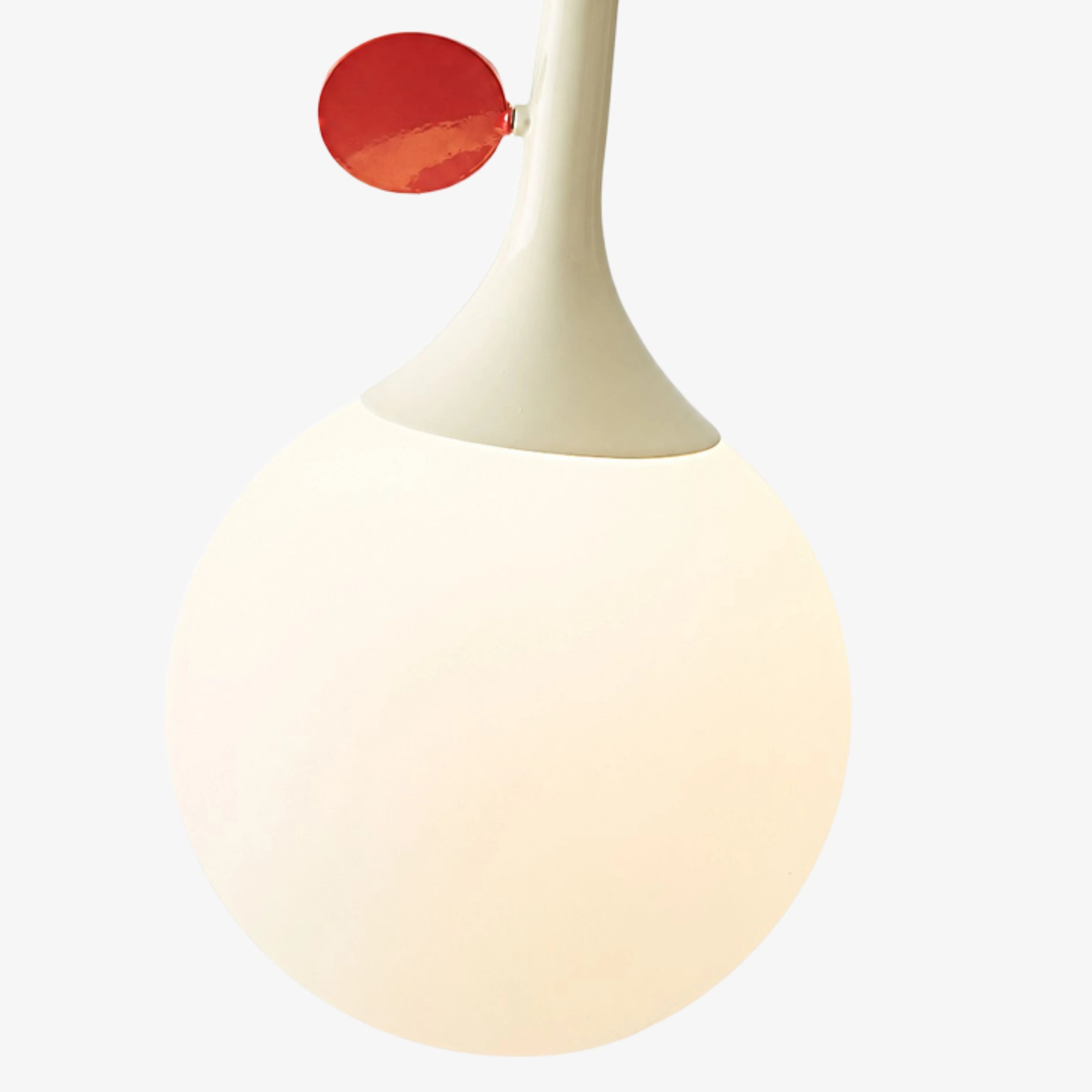 Cream globe and red orbit disc detail