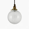Style A brass pendant light with round clear crackle glass shade