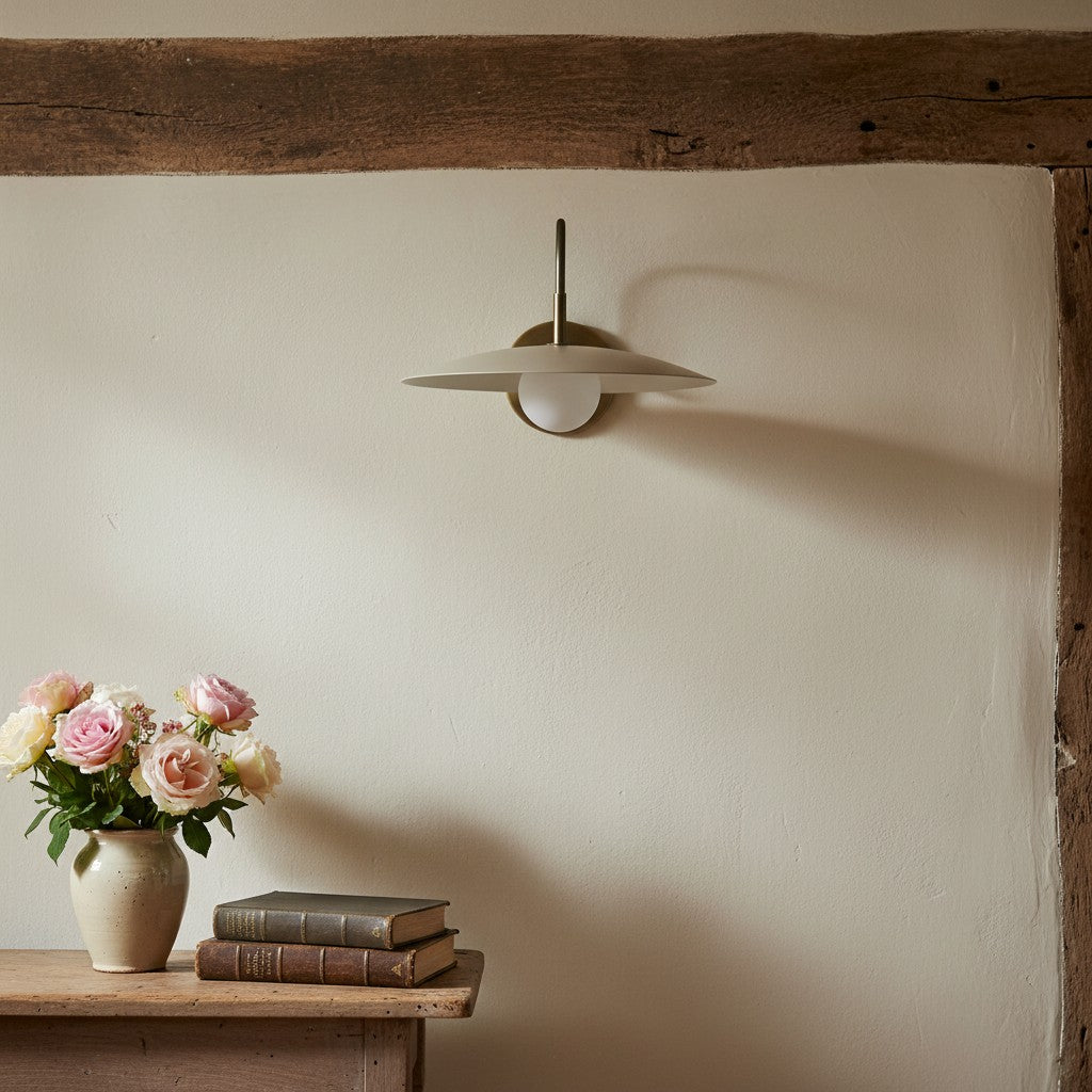 Curva Metal Modern Wall Sconce - Antique Brass Arm with Cream Disc Shade