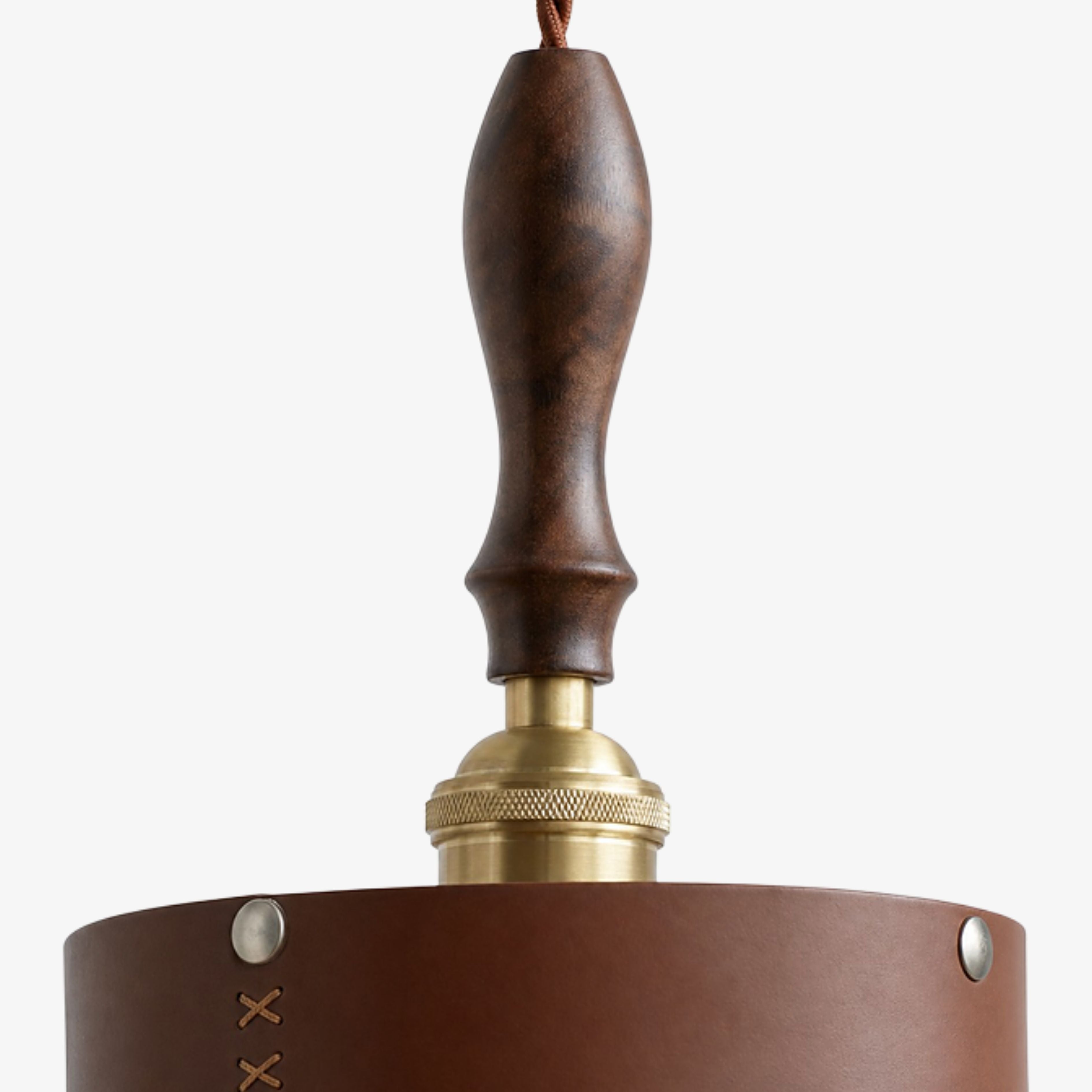 Turned dark wood handle and antique brass socket detail
