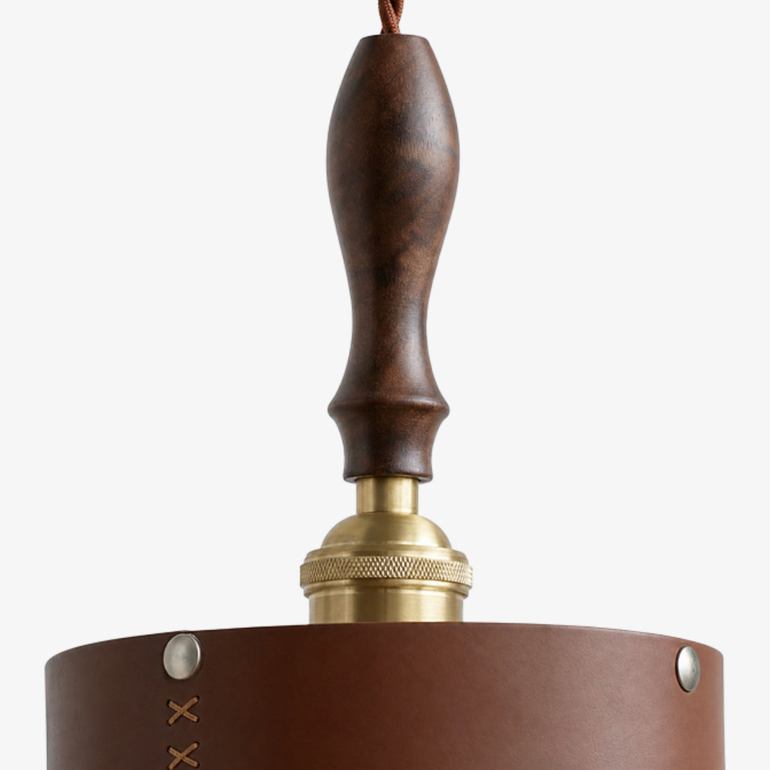 Turned dark wood handle and antique brass socket detail