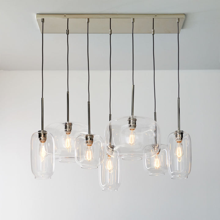 Lumivelle Sculptural 7-Light Chandelier – Adjustable Height Modern Glass Pendant