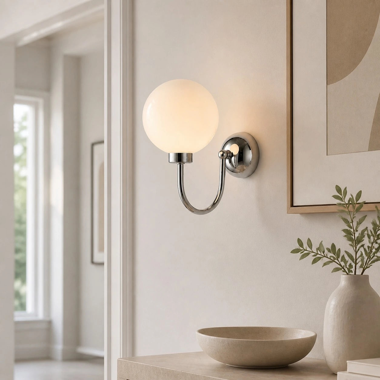 Style A Chrome Luma wall sconce near framed wall art