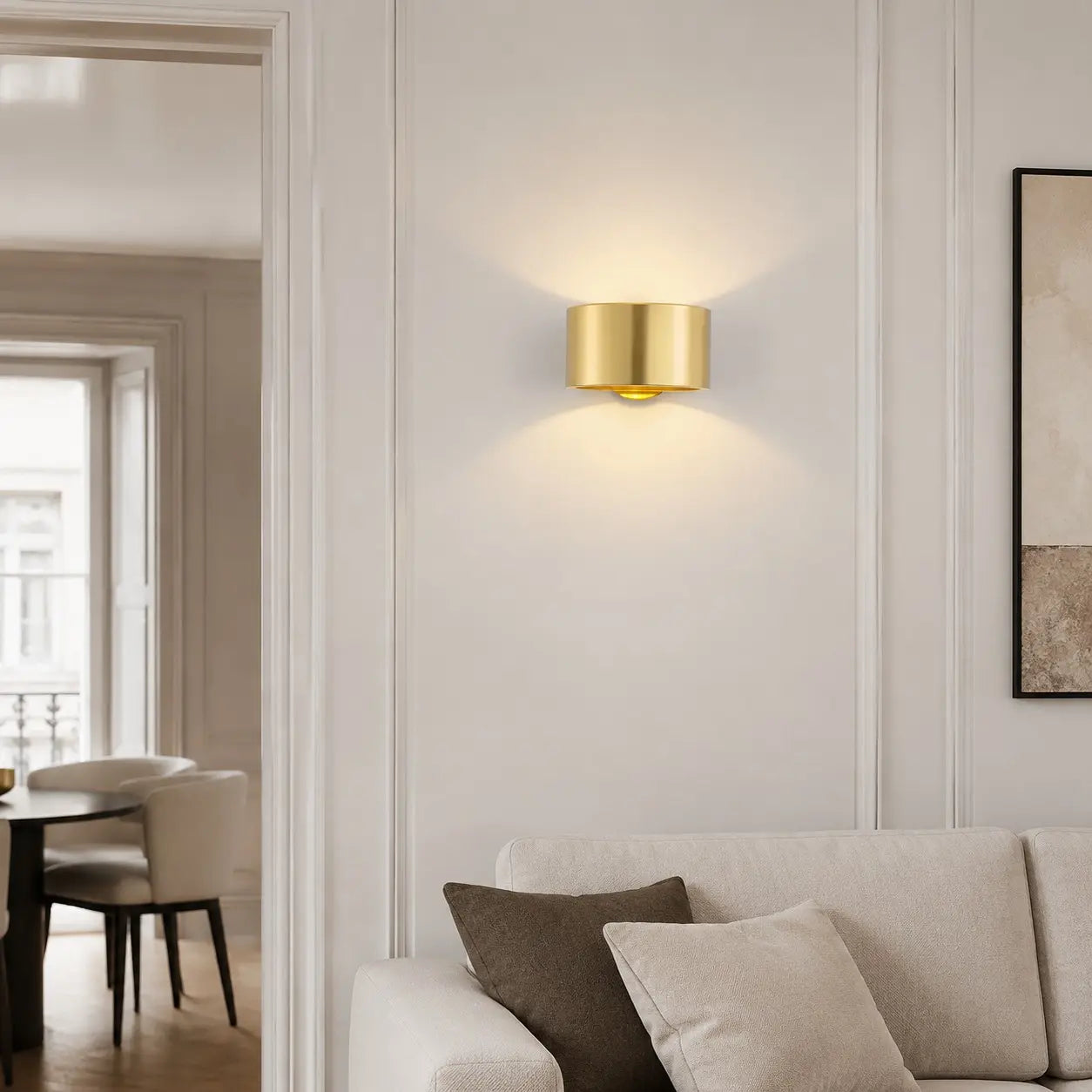 Gold brass wall light in a refined interior