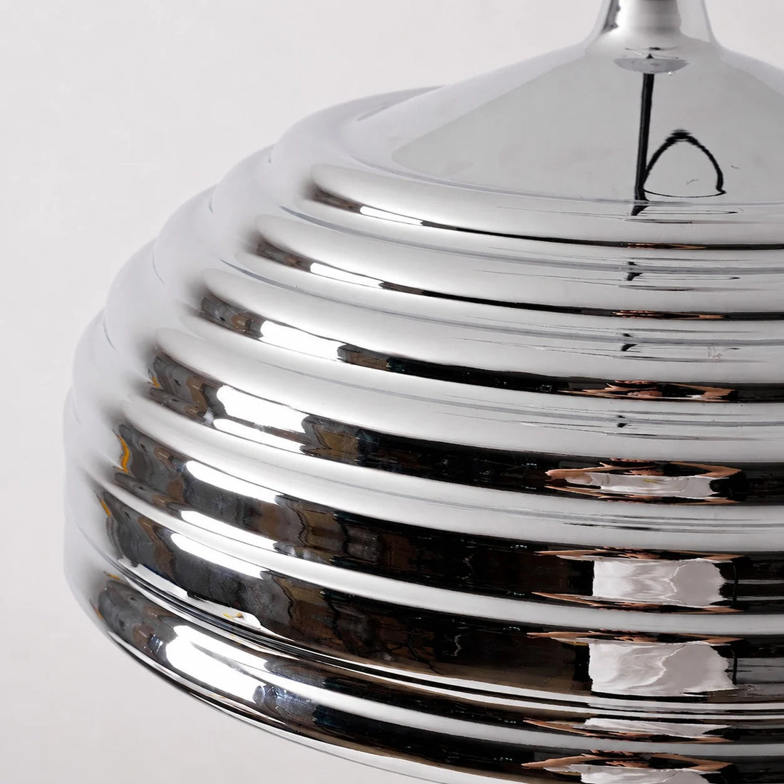 Close view of the ribbed polished chrome dome shade